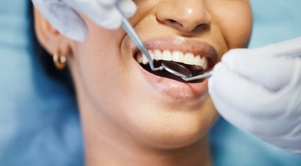 Dentist performing oral examination
